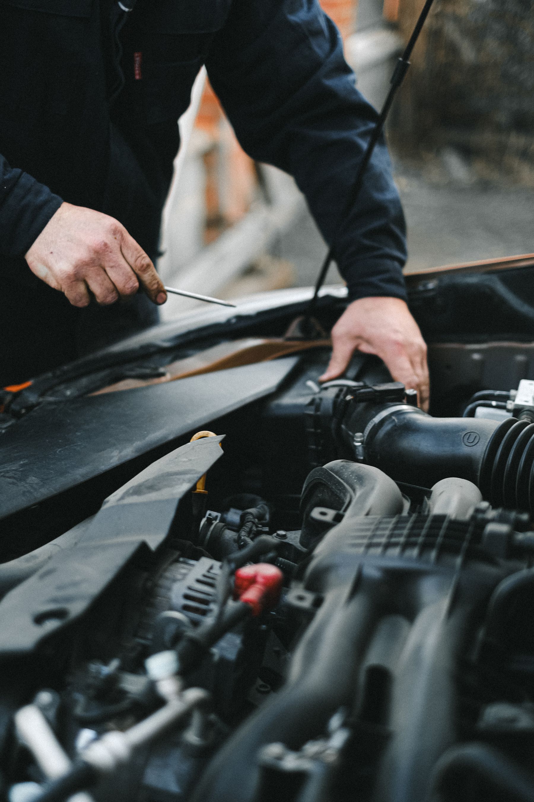 Technician carrying out general passenger vehicle engine work